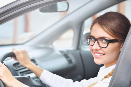 Portrait of a businesswoman siting in the car. Business conceptの写真素材