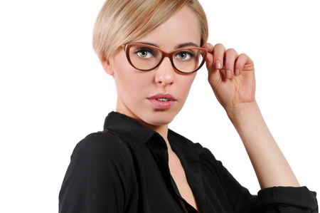 Young beautiful blonde woman adjust trendy glassesの写真素材