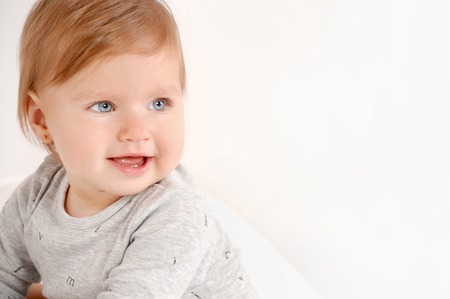 Portrait of a little sweet girl at home. Close up portrait. Happy childhood conceptの写真素材