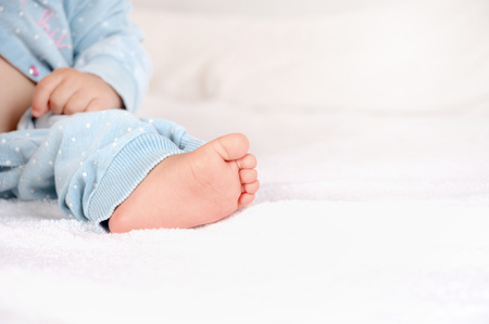 Lovely infant foot. The baby is one year old. Happy childhood conceptの写真素材
