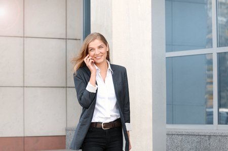 Closeup portrait attractive happy, smiling business woman walking on streetの写真素材
