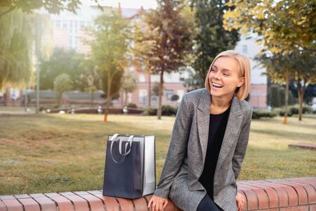 Beautiful woman in town with shopping bags. Happy lifestyle conceptの写真素材