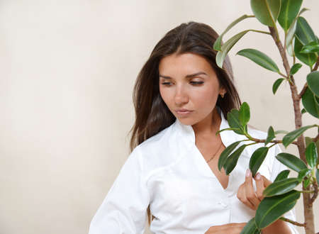 Portrait of beautiful brunette woman with healthy natural glowing skin. Healthy beauty concept.の写真素材