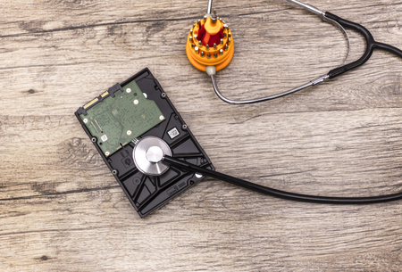 screwdriver cures a hard disk with stethoscope
