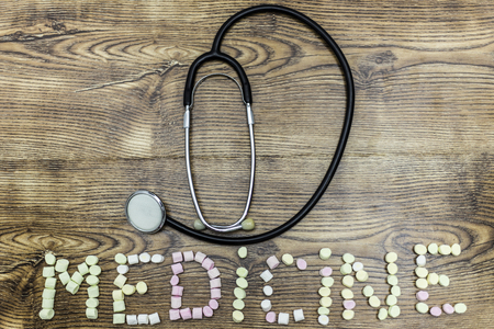 stethoscope with marshmallow balls forming the word: MEDICINEの写真素材