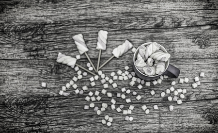 cup of marshmallows with sticks and marshmallow ballsの写真素材