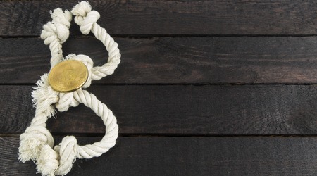 formed the letter B with rope on wooden background