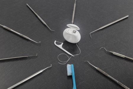 Dental care with dental floss and toothbrush.の写真素材