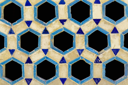 Oriental style window lattice made of bricks.