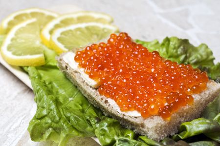 Bread with salmon caviarの写真素材