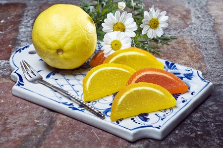 Colorful fruit jelly with lemon on decorative trayの写真素材