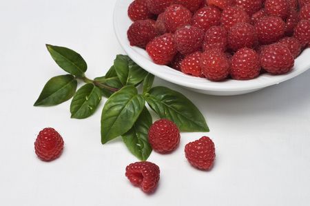 Fresh raspberries in bowlの写真素材
