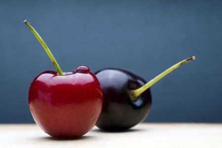 Cherries on blue backgroundの写真素材