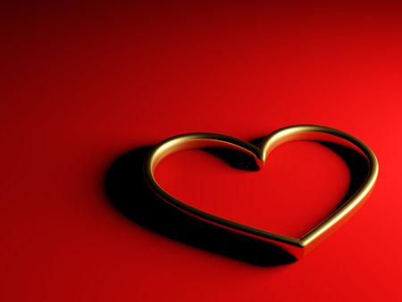 Golden heart isolated on red backgroundの写真素材