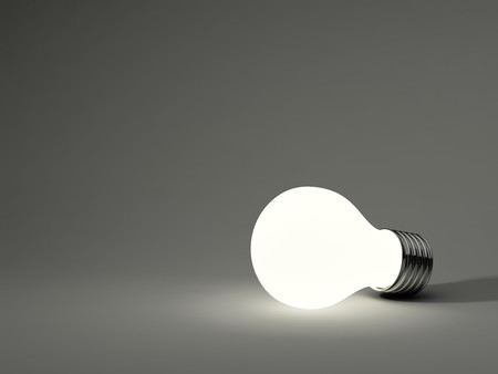 Light bulb isolated on grey backgroundの写真素材