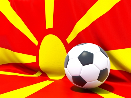 Flag of macedonia with football in front of itの写真素材