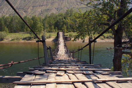 Bridge through Chulyshman river, Altay mountains.の写真素材