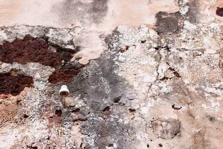 Texture of an ancient wall with rust and cracksの写真素材
