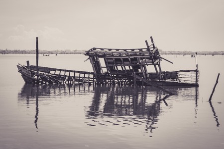 Skeleton of the sunken boat in a lake. Ship wreck in Cambodiaの写真素材