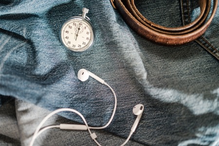 Men's pocket watch and accessories on jeans background. Top viewの写真素材
