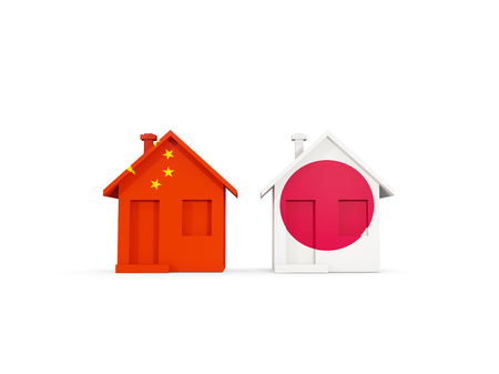 Two houses with flags of China and japan isolated on white. Communication concept. 3D illustrationの写真素材