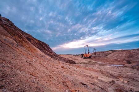 Coal mining at an open pit at sunset. Coal mine in Russiaの写真素材