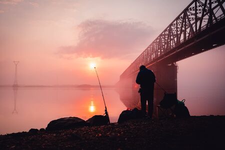 Fisherman in front of the ridge.  Early morningの写真素材