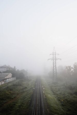 Empty rail track in the morning mist. Transportation industryの写真素材