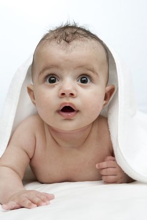 little baby after bath under white towel. の写真素材