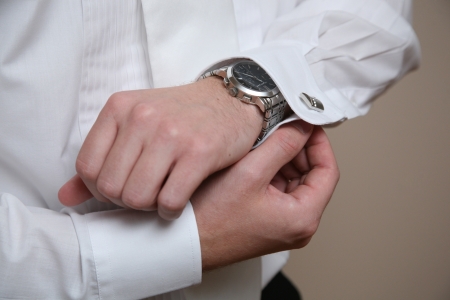 Groom gets dressed for his wedding.