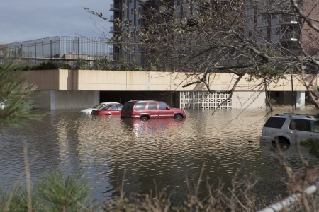 NEW YORK - November 1: Flooding in the parking lot  in Far Rockaway after hurricane Sandy  October 29, 2012 in New York City, NYのeditorial素材