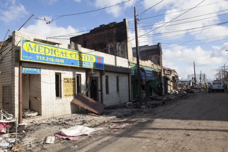 NEW YORK - October 31: Homes sit smoldering after Hurricane Sandy  in the Far Rockaway area . Over 50 homes were reportedly destroyed in a fire during the storm on October 30; 2012 in New York City; NYのeditorial素材
