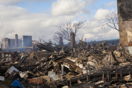 NEW YORK - October 31: Homes sit smoldering after Hurricane Sandy  in the Far Rockaway area . Over 50 homes were reportedly destroyed in a fire during the storm on October 30; 2012 in New York City; NYのeditorial素材
