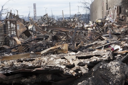 NEW YORK - October 31: Homes sit smoldering after Hurricane Sandy on October 30; 2012 in the Far Rockaway area . Over 50 homes were reportedly destroyed in a fire during the storm on October 30; 2012 in New York City; NYのeditorial素材