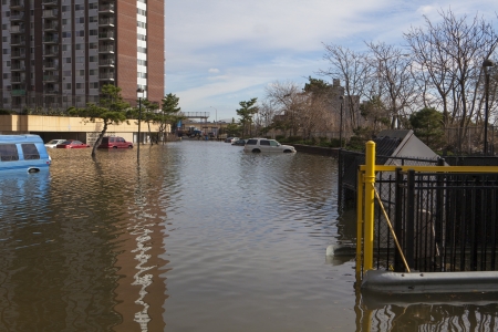 NEW YORK - November 1: Flooding in the parking lot  in Far Rockaway after hurricane Sandy  October 29, 2012 in New York City, NYのeditorial素材