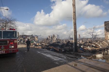 NEW YORK - October 31: Homes sit smoldering after Hurricane Sandy  in the Far Rockaway area . Over 50 homes were reportedly destroyed in a fire during the storm on October 30; 2012 in New York City; NYのeditorial素材