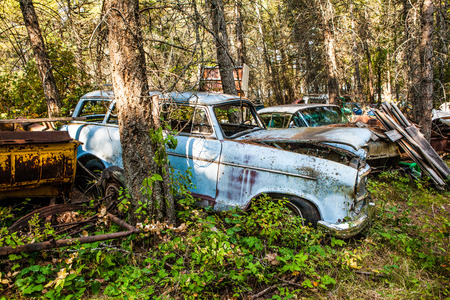 Kalispell - August 2:  Old cars and trucks in the  junk yards August 2, 2015 at Kalispel, MT.のeditorial素材