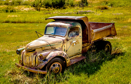 Kalispell - August 2:  Old cars and trucks in the  junk yards August 2, 2015 at Kalispel, MT.のeditorial素材