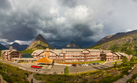 GLACIER NATIONAL PARK, USA - August 8: The Many Glacier Hotel on August 8, 2011 in Glacier National Park, Montana. It was built in 1915 on the shoreline of Swiftcurrent Lake.のeditorial素材