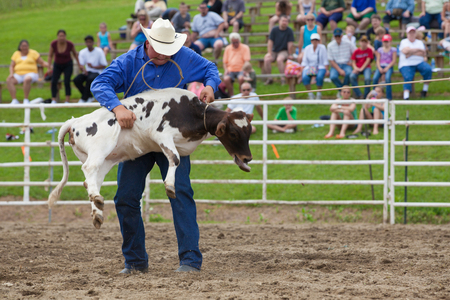 Ellicottville, New York - July 4 : Cowboy Participating Competition. Championship Rodeo, Located in the beautiful Enchanted Mountains that surround Ellicottville New York, USA on July 4 2011のeditorial素材