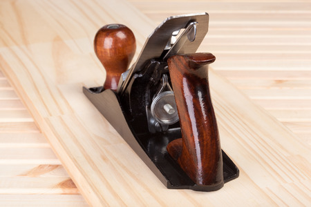 Wood Plane on wooden background 