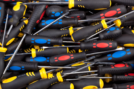 Pile of multicolored screwdrivers  Textured background image の写真素材