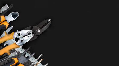 Black background set tools of locksmith, hand metalworking and locksmithing, composition isolated on...