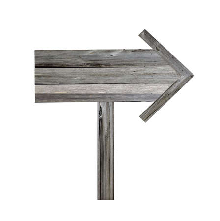 Old wooden signpost on white background. Arrow road sign, empty, decrepit wood texture, ancient boardの写真素材