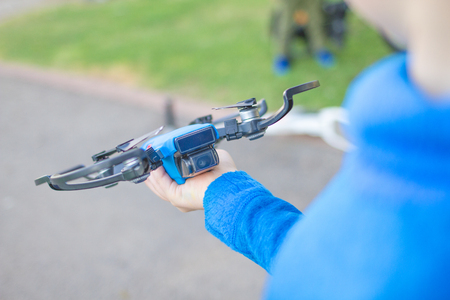 Child playing with drone outdoors at summer dayの写真素材