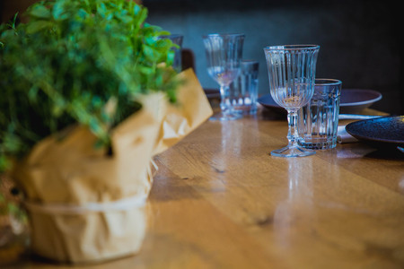 flowers on a banquet table with empty dishes