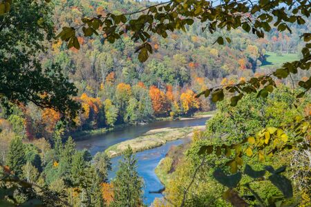 Golden autumn in early October in the Gauja National Park in Latvia. View from the mountain on the picturesque valley of the river Gauja.の写真素材
