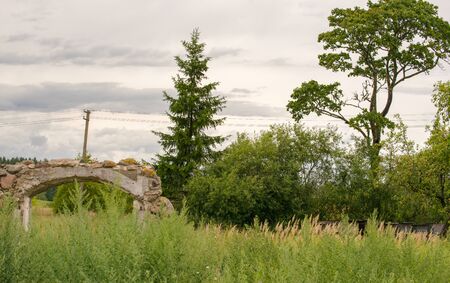 Fragment of the old destroyed wall from the stone house in the village.の写真素材