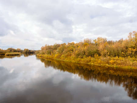 The Gauja River in Latvia on a warm bright day in golden autumnの写真素材