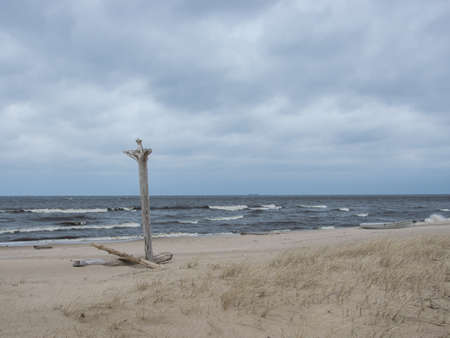 Old fisherman boat at sunrise time on the beachの写真素材